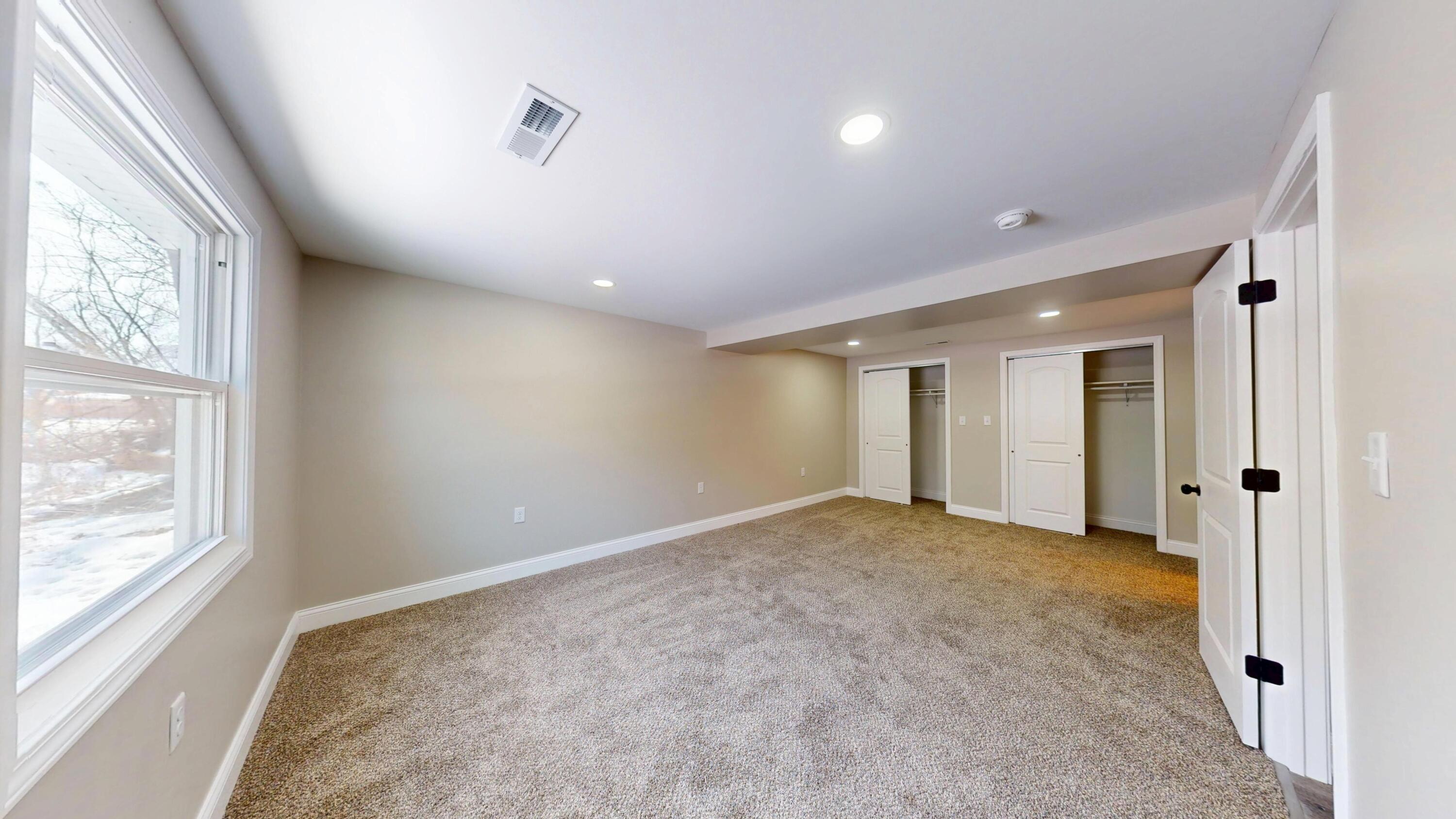 1528 Hanley Street Gary, IN 46406 - Photo 7 of 44 an empty room with windows and closet