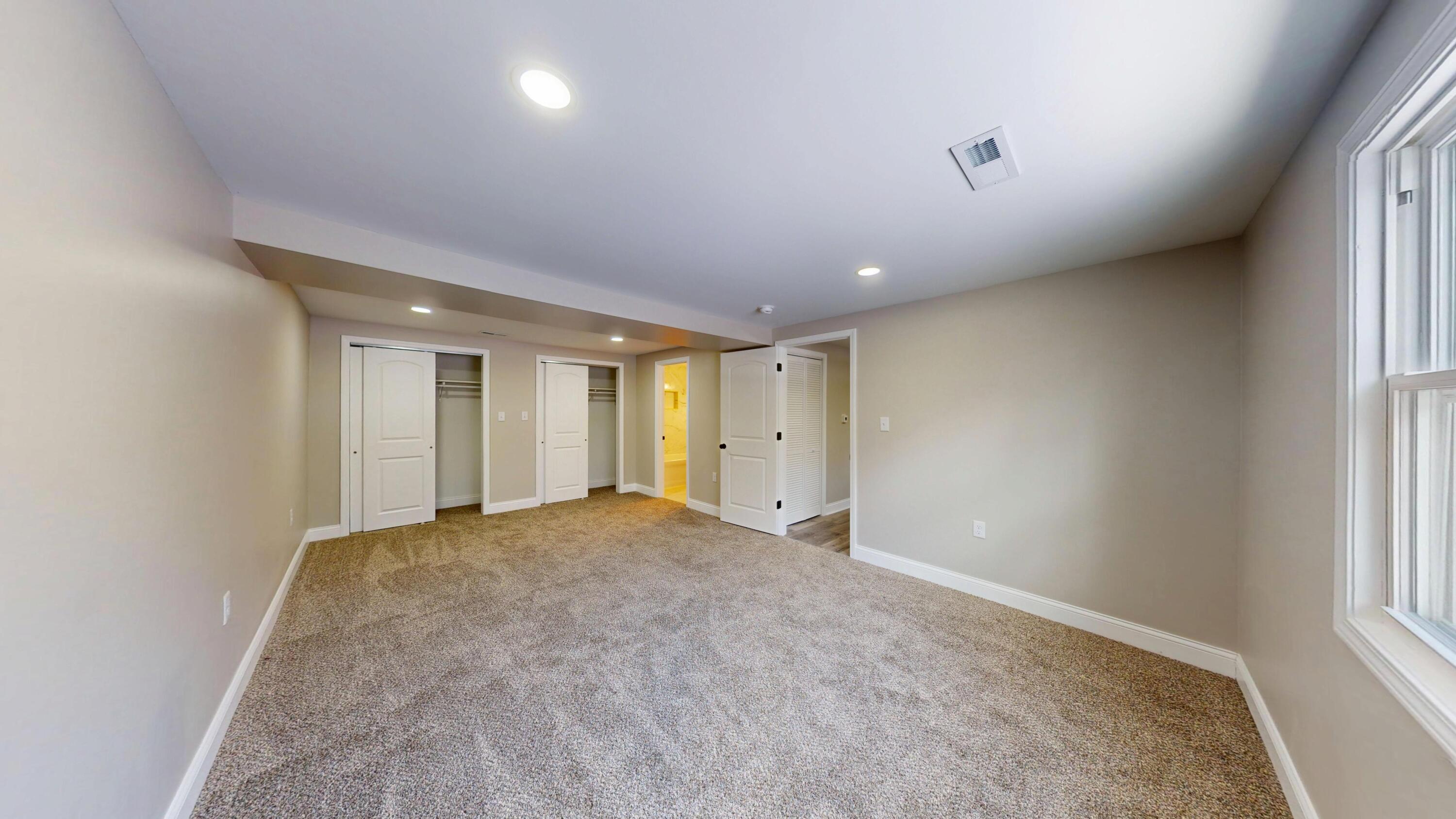 1528 Hanley Street Gary, IN 46406 - Photo 8 of 44 an empty room with windows and closet