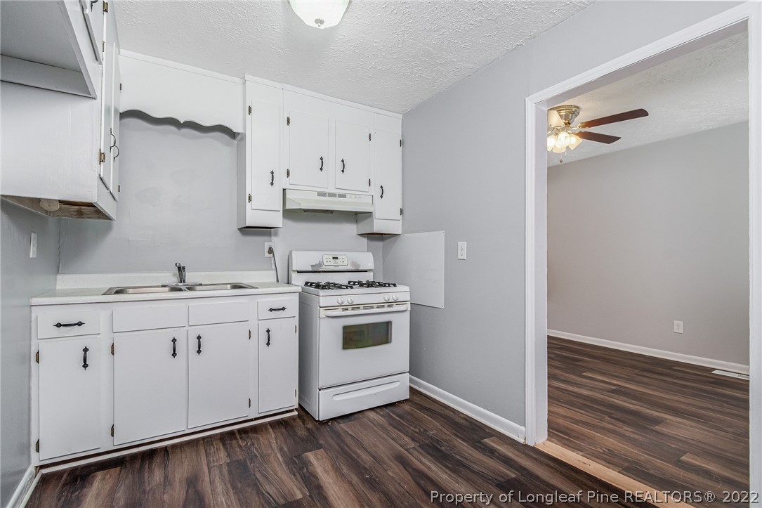 25627 Harris Road Marston, NC 28363 - Photo 11 of 30 a kitchen with cabinets a sink and appliances