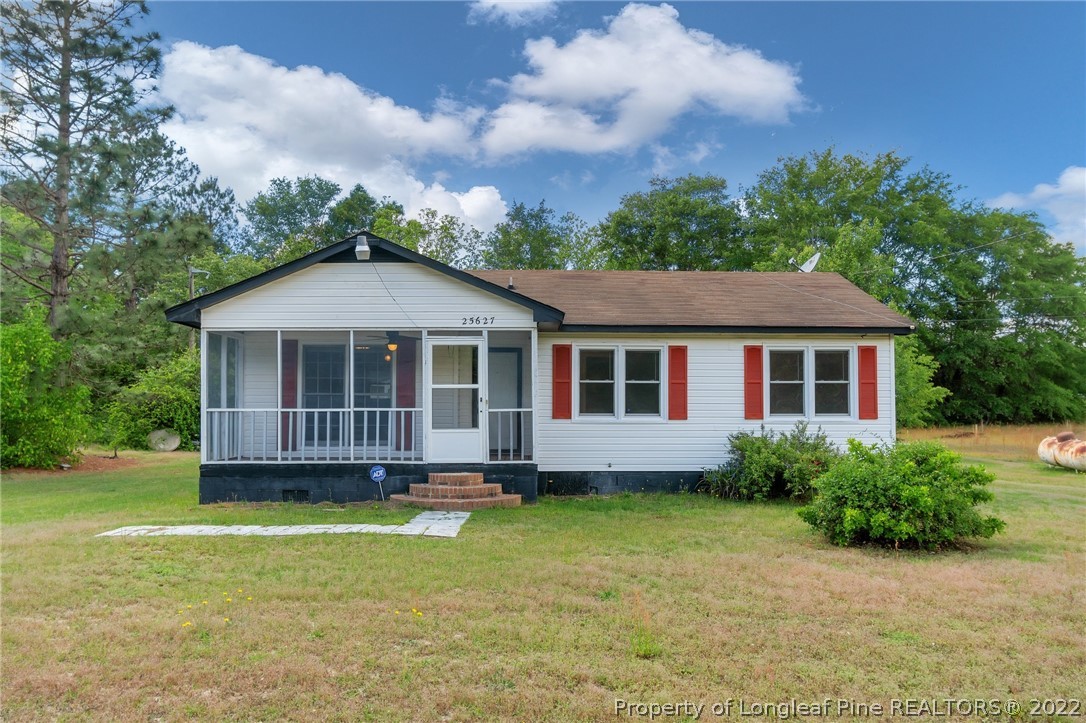 25627 Harris Road Marston, NC 28363 - Photo 2 of 30 a front view of a house with a garden