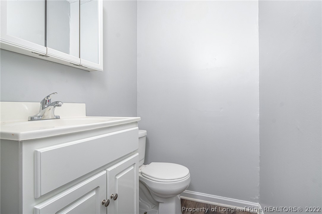 25627 Harris Road Marston, NC 28363 - Photo 25 of 30 a bathroom with a sink a toilet and a mirror