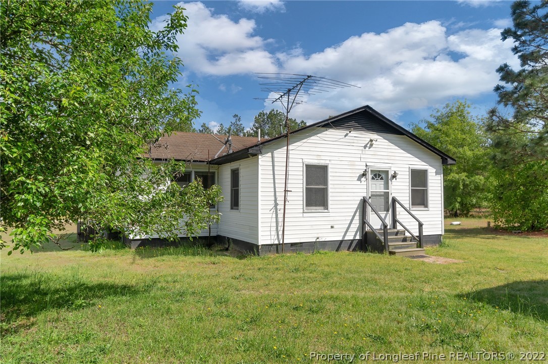 25627 Harris Road Marston, NC 28363 - Photo 27 of 30 a front view of house with yard and outdoor seating