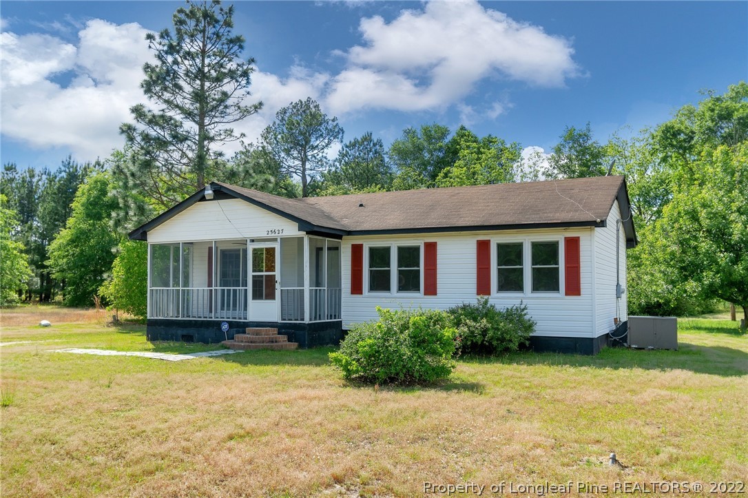 25627 Harris Road Marston, NC 28363 - Photo 3 of 30 a front view of a house with a yard