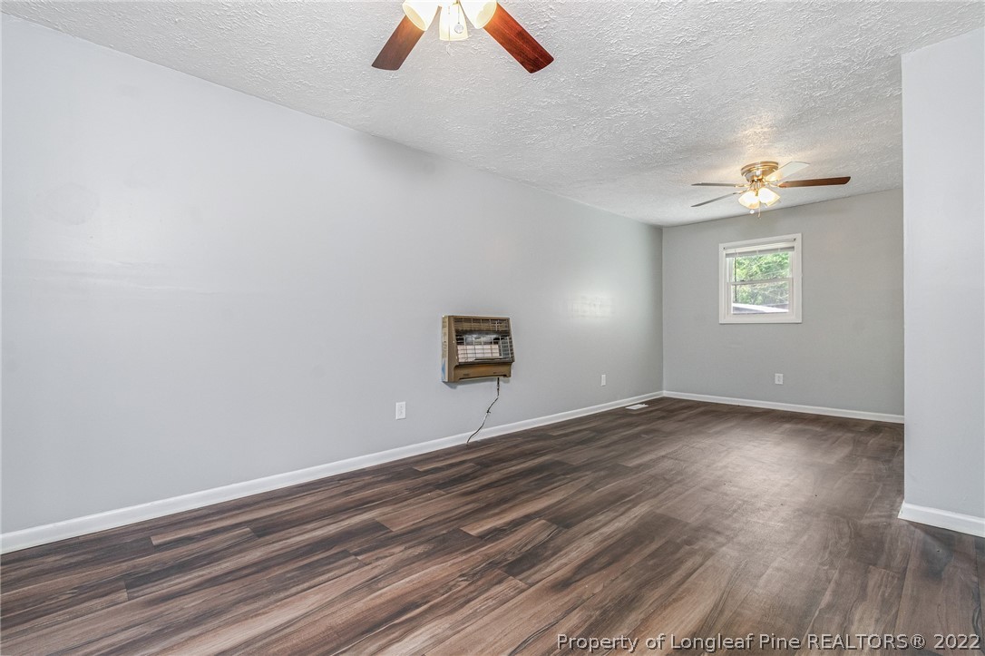 25627 Harris Road Marston, NC 28363 - Photo 6 of 30 wooden floor in an empty room with a window