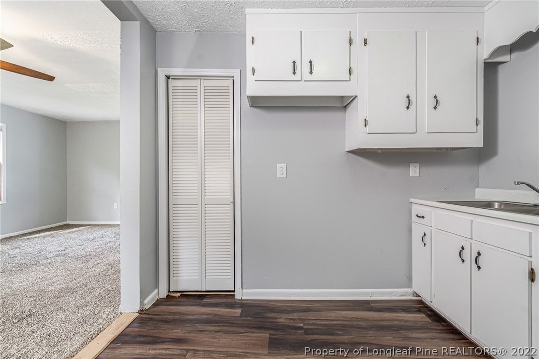 25627 Harris Road Marston, NC 28363 - Photo 9 of 30 a view of cabinets with wooden floor