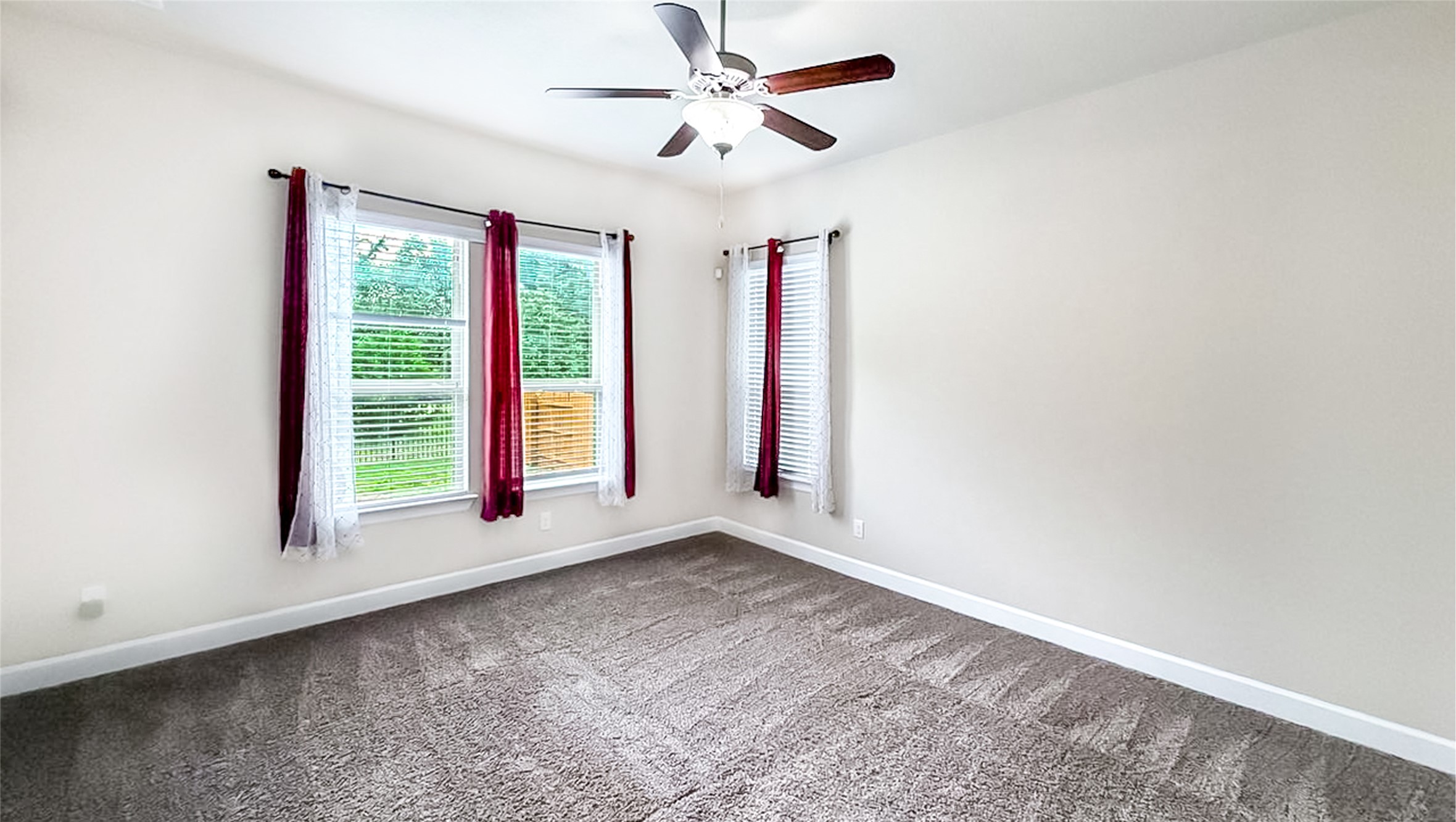 184 Fort Cobb Way Georgetown, TX 78628 - Photo 23 of 33 an empty room with a window and a ceiling fan