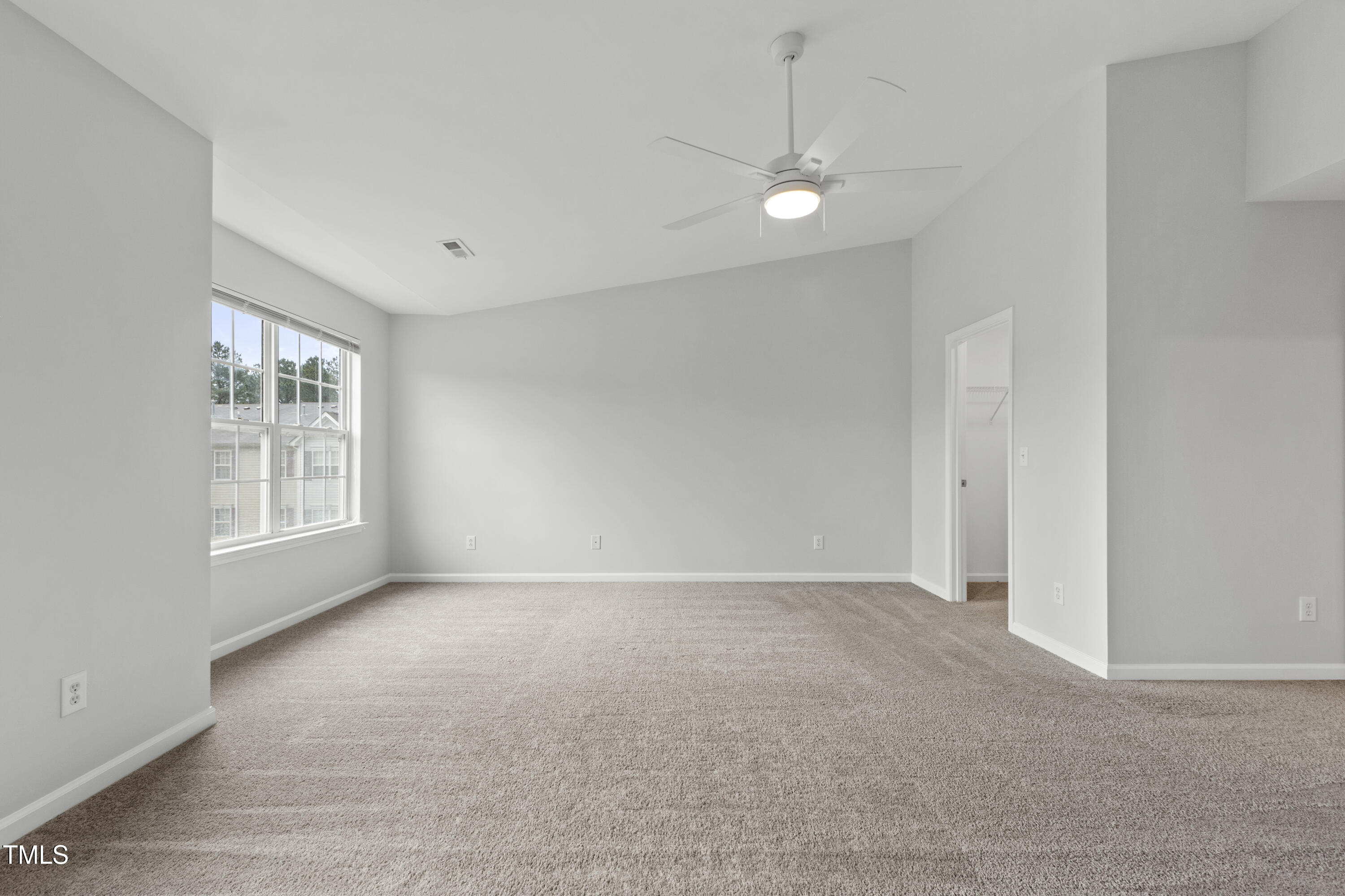 8610 Neuse Landing Lane, Unit 103 Raleigh, NC 27616 - Photo 10 of 28 a view of an empty room with a window