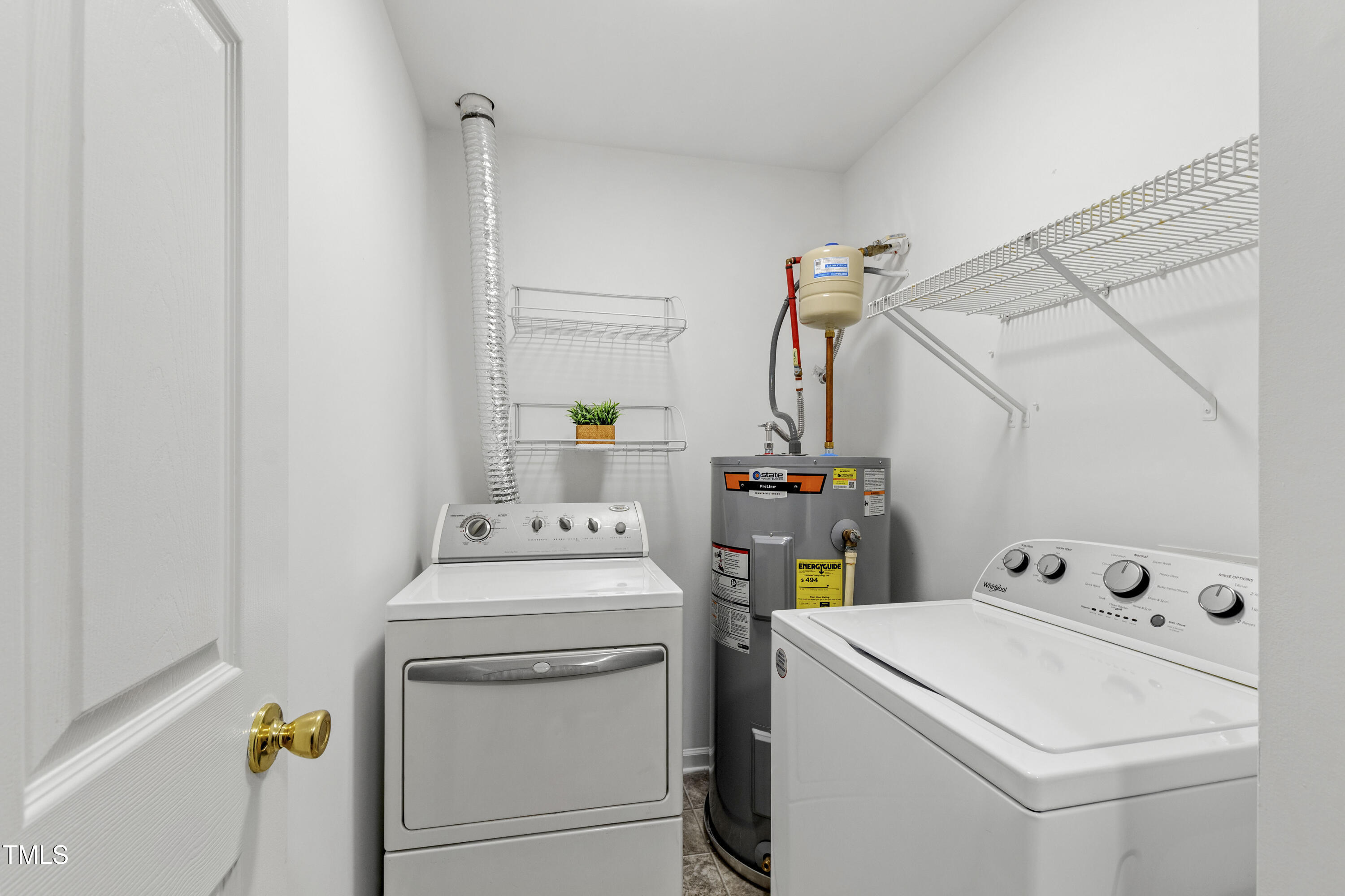 8610 Neuse Landing Lane, Unit 103 Raleigh, NC 27616 - Photo 24 of 28 a utility room with dryer and washer