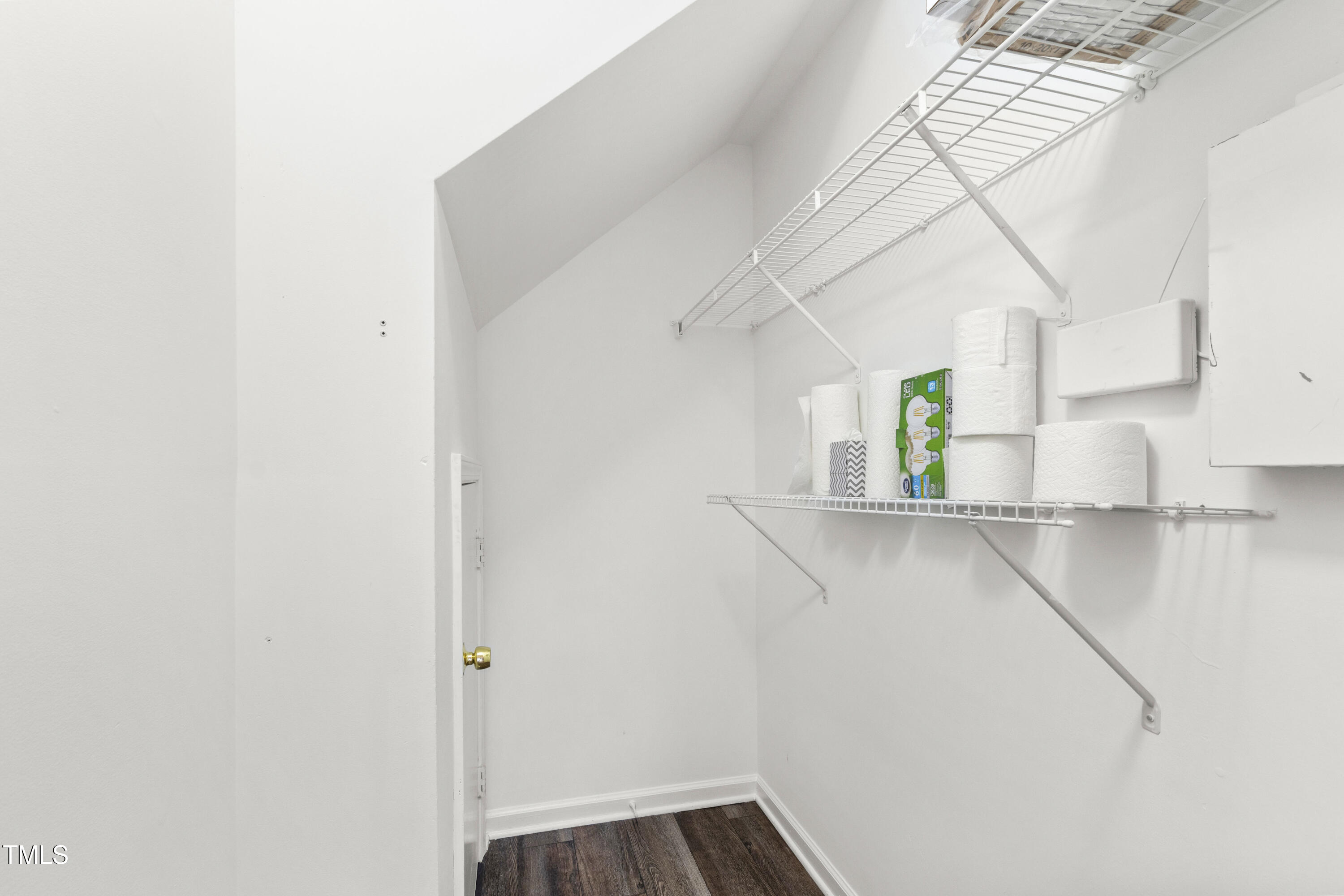 8610 Neuse Landing Lane, Unit 103 Raleigh, NC 27616 - Photo 25 of 28 a view of a storage & utility room with wooden floor
