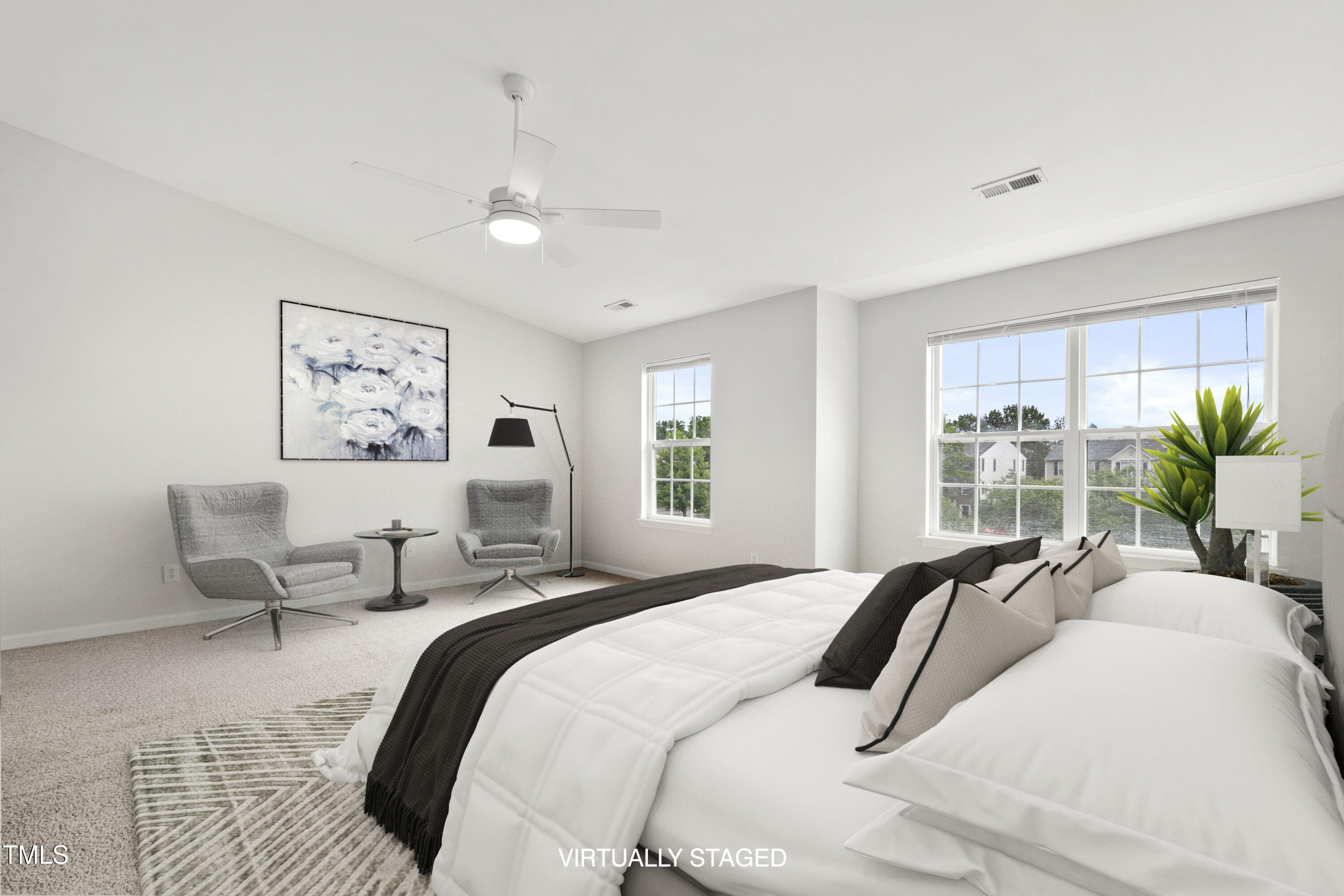 8610 Neuse Landing Lane, Unit 103 Raleigh, NC 27616 - Photo 4 of 28 a bedroom with a large bed couch and a window