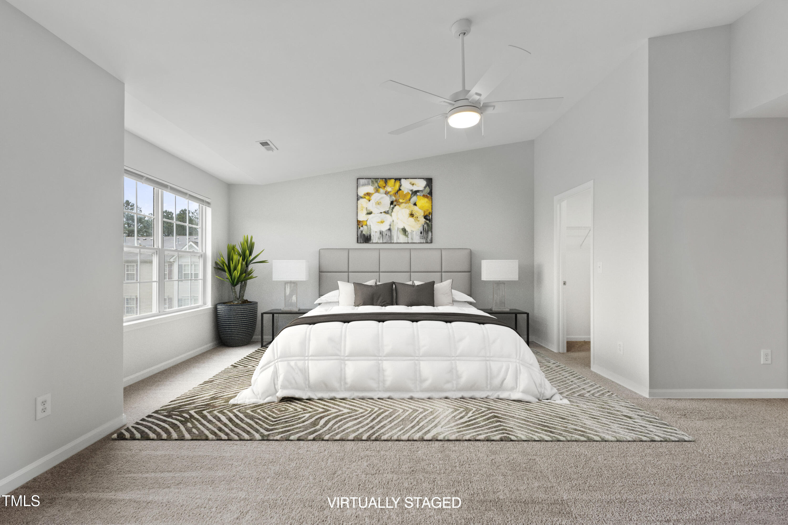 8610 Neuse Landing Lane, Unit 103 Raleigh, NC 27616 - Photo 5 of 28 a spacious bedroom with a bed and window