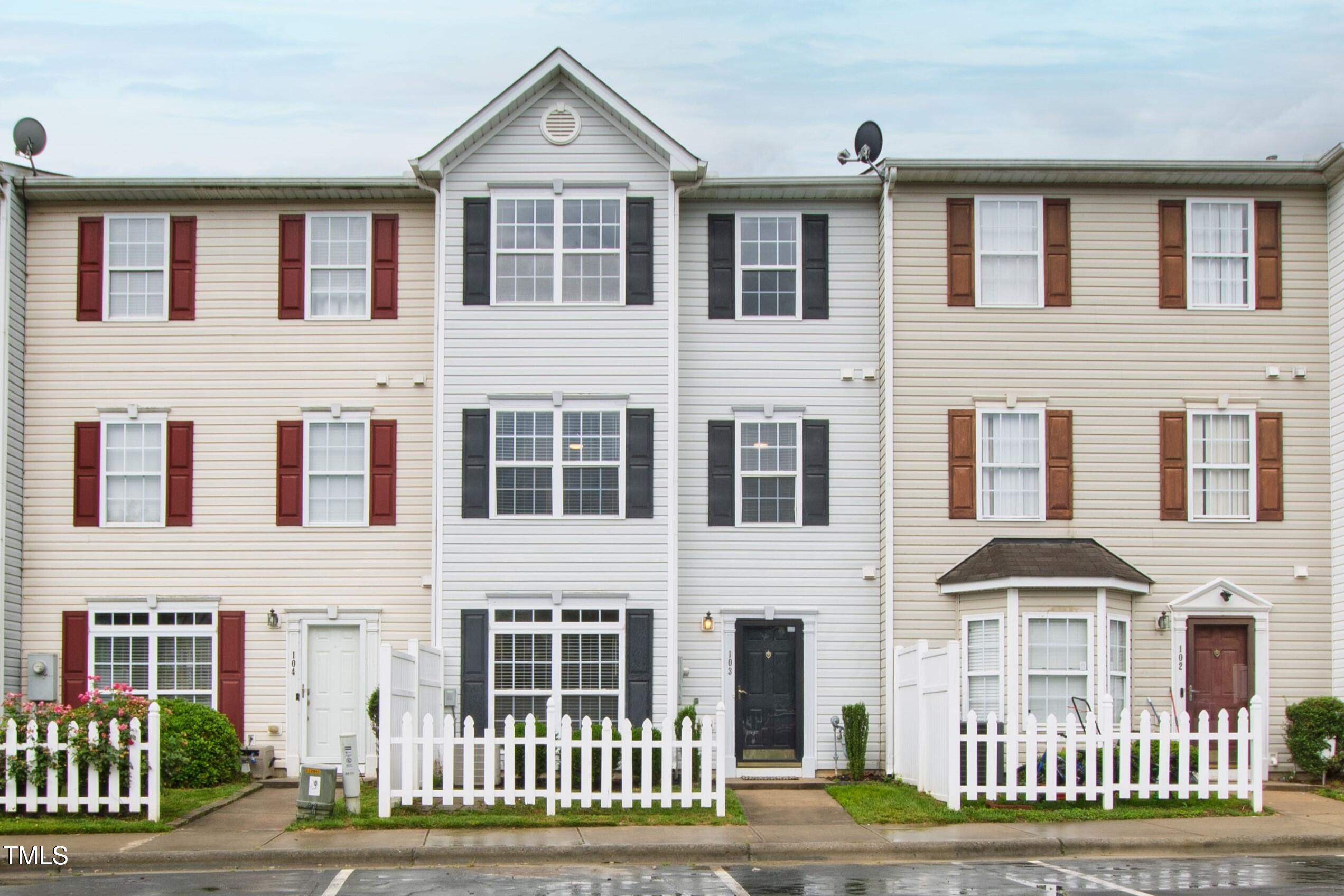 8610 Neuse Landing Lane, Unit 103 Raleigh, NC 27616 - Photo 6 of 28 a front view of a house with a yard