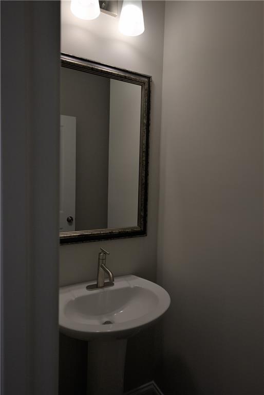 977 Catamaran Court Alpharetta, GA 30005 - Photo 14 of 39 a bathroom with a sink and a mirror