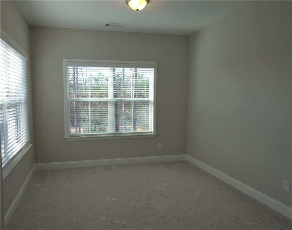 977 Catamaran Court Alpharetta, GA 30005 - Photo 15 of 39 an empty room with a window