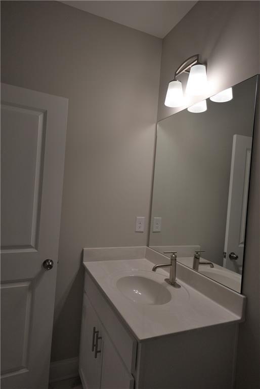 977 Catamaran Court Alpharetta, GA 30005 - Photo 24 of 39 a bathroom with a sink and a mirror