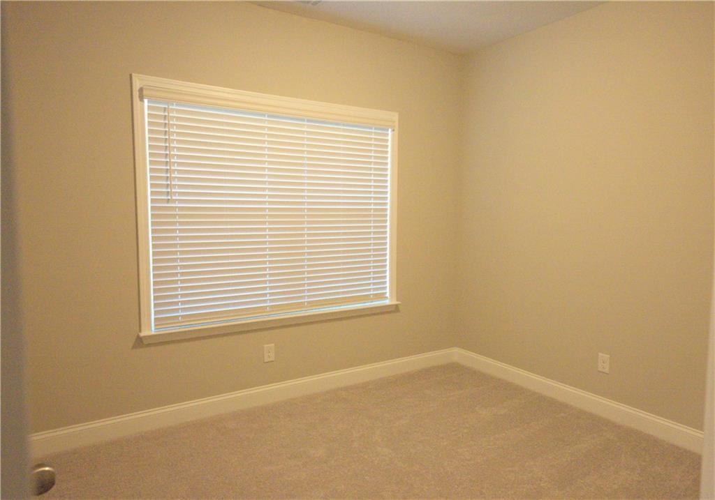977 Catamaran Court Alpharetta, GA 30005 - Photo 28 of 39 a view of an empty room with a window
