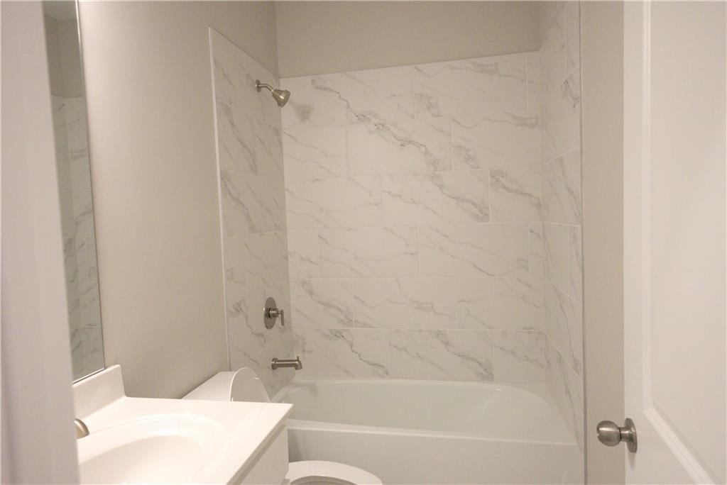 977 Catamaran Court Alpharetta, GA 30005 - Photo 30 of 39 a bathroom with a bathtub and shower