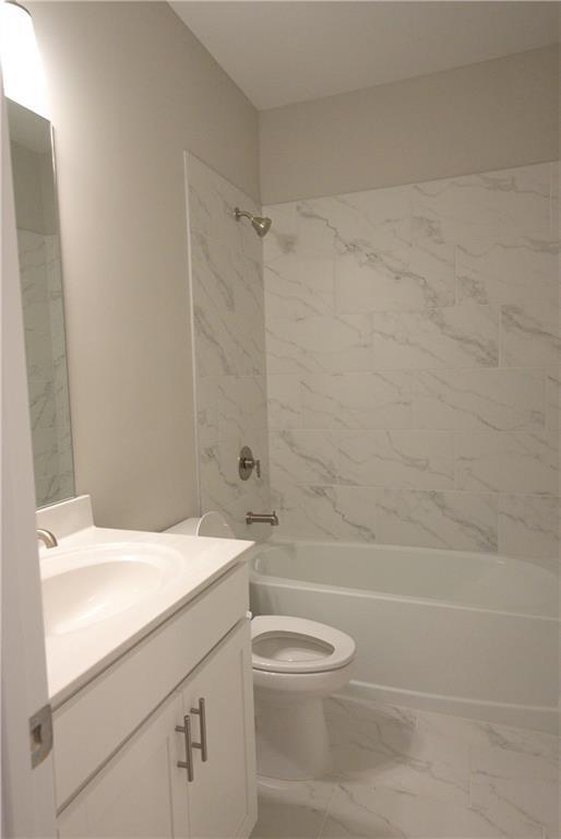 977 Catamaran Court Alpharetta, GA 30005 - Photo 31 of 39 a bathroom with a sink a toilet and shower