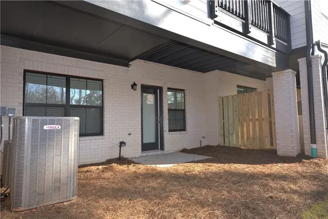 a view of a backyard with large trees