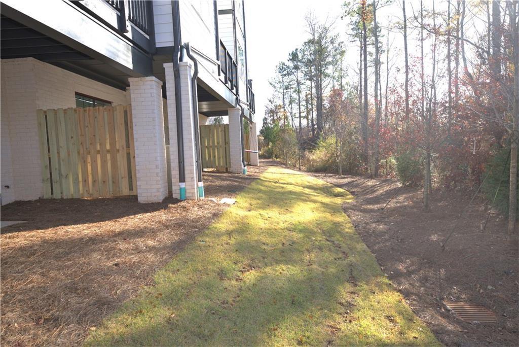 977 Catamaran Court Alpharetta, GA 30005 - Photo 35 of 39 a view of backyard of white house