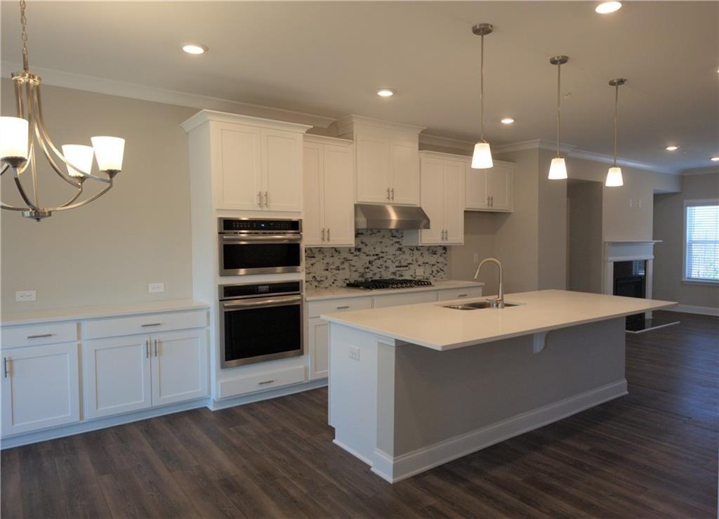 977 Catamaran Court Alpharetta, GA 30005 - Photo 4 of 39 a kitchen with a sink and a stove top oven