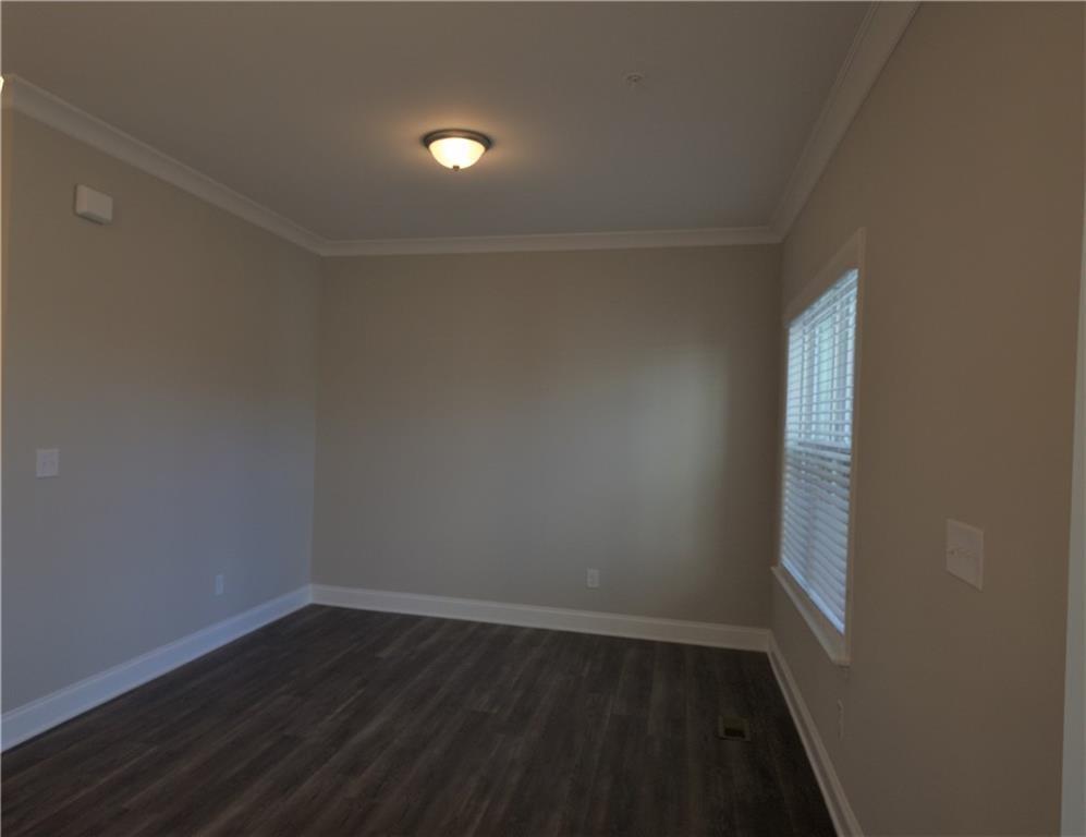 977 Catamaran Court Alpharetta, GA 30005 - Photo 7 of 39 a view of an empty room with wooden floor and a window