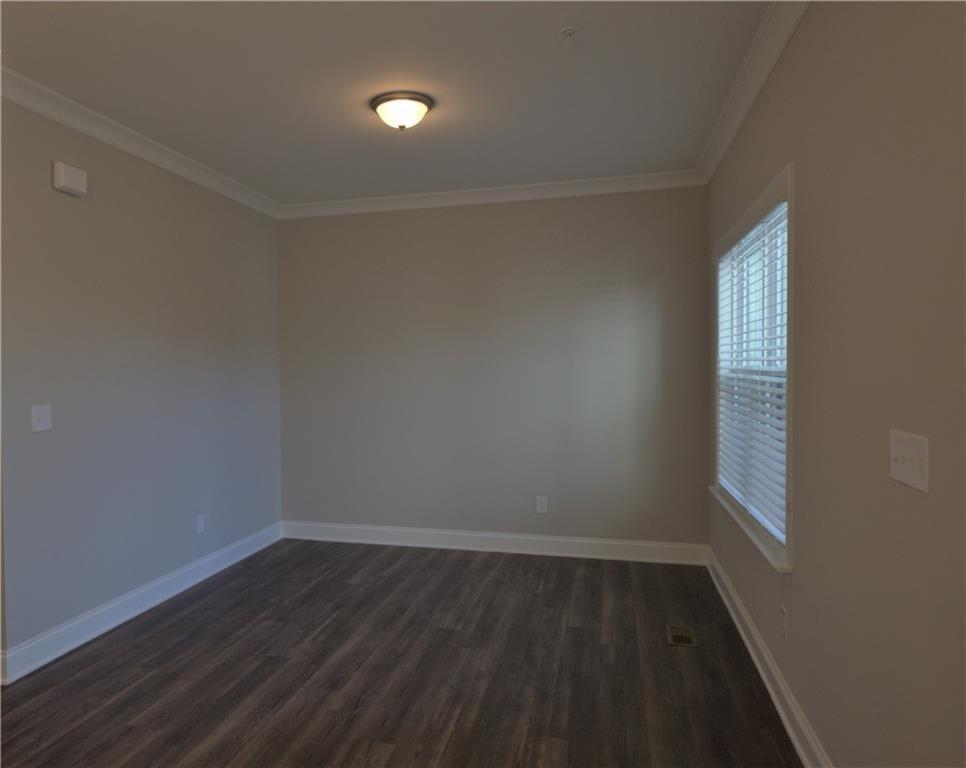 977 Catamaran Court Alpharetta, GA 30005 - Photo 8 of 39 wooden floor in an empty room with a window