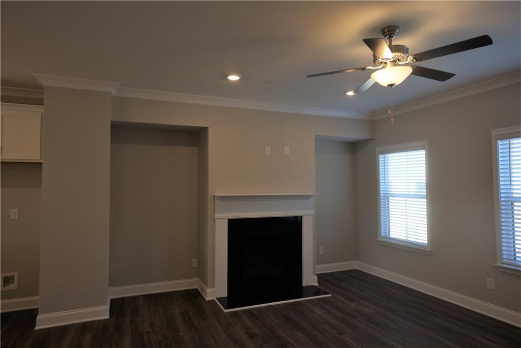 977 Catamaran Court Alpharetta, GA 30005 - Photo 9 of 39 a view of an empty room with wooden floor and a window