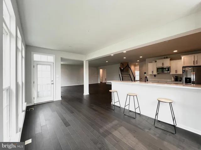 a view of kitchen with cabinets and wooden floor