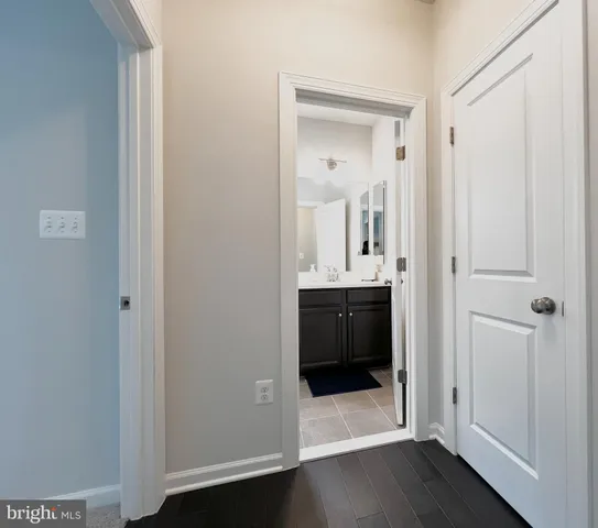 a en suite bathroom with a sink and a mirror