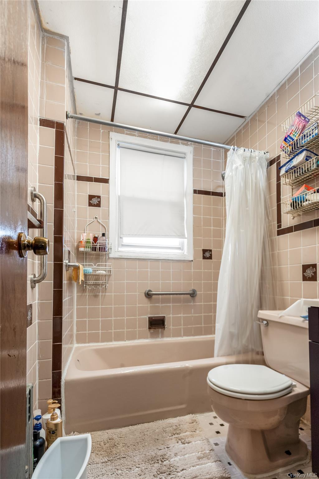 104-37 125th Street Queens, NY 11419 - Photo 19 of 24 a bathroom with a sink toilet and shower
