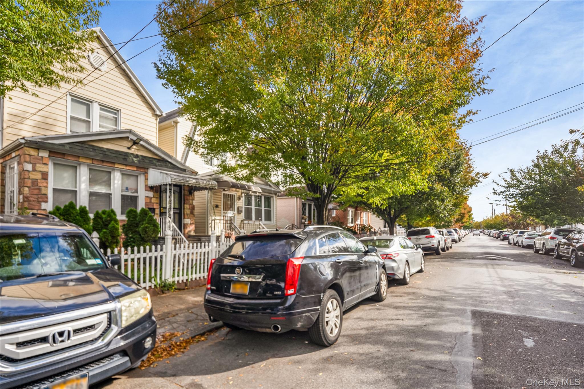 104-37 125th Street Queens, NY 11419 - Photo 3 of 24 a view of a street with cars