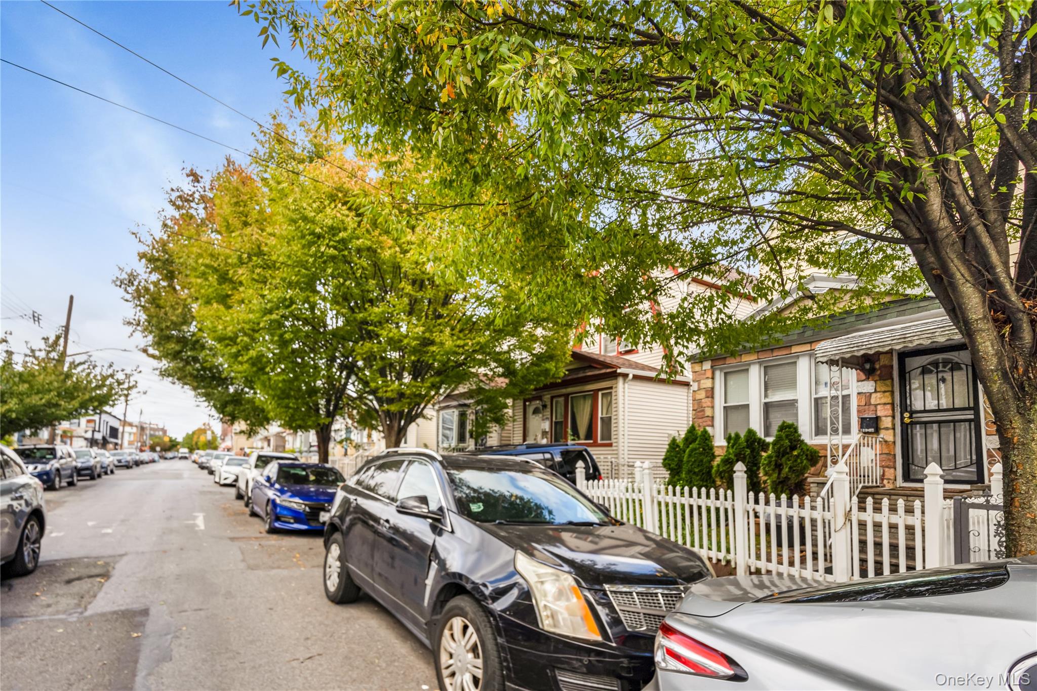 104-37 125th Street Queens, NY 11419 - Photo 4 of 24 a view of a patio with table and chairs and potted plants