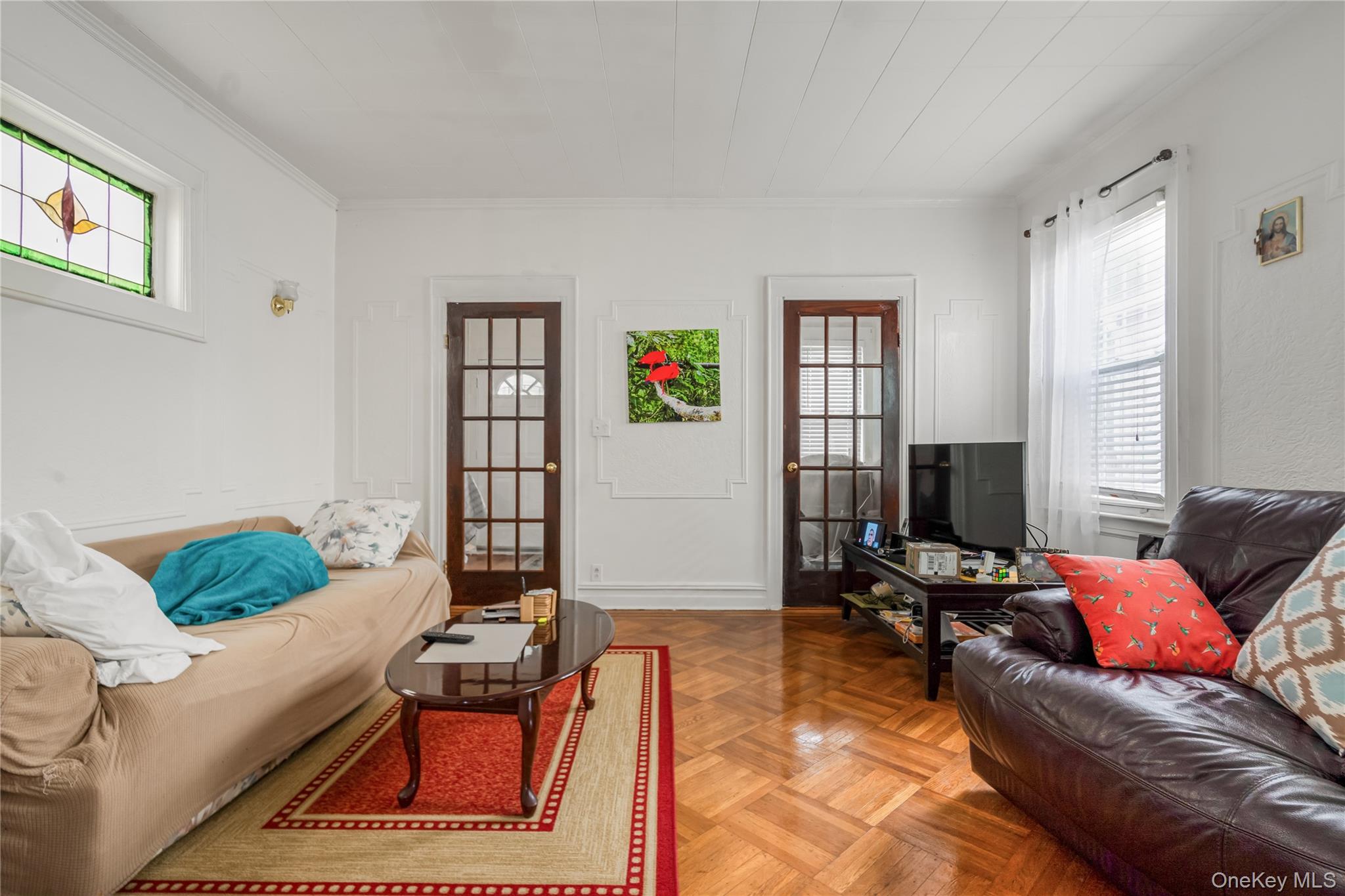 104-37 125th Street Queens, NY 11419 - Photo 5 of 24 a living room with furniture and a window