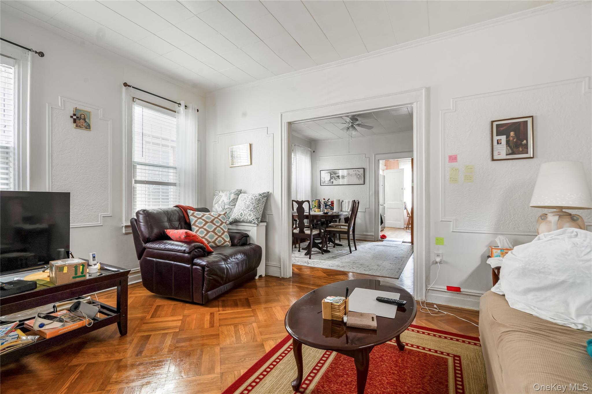 104-37 125th Street Queens, NY 11419 - Photo 6 of 24 a living room with furniture and a flat screen tv