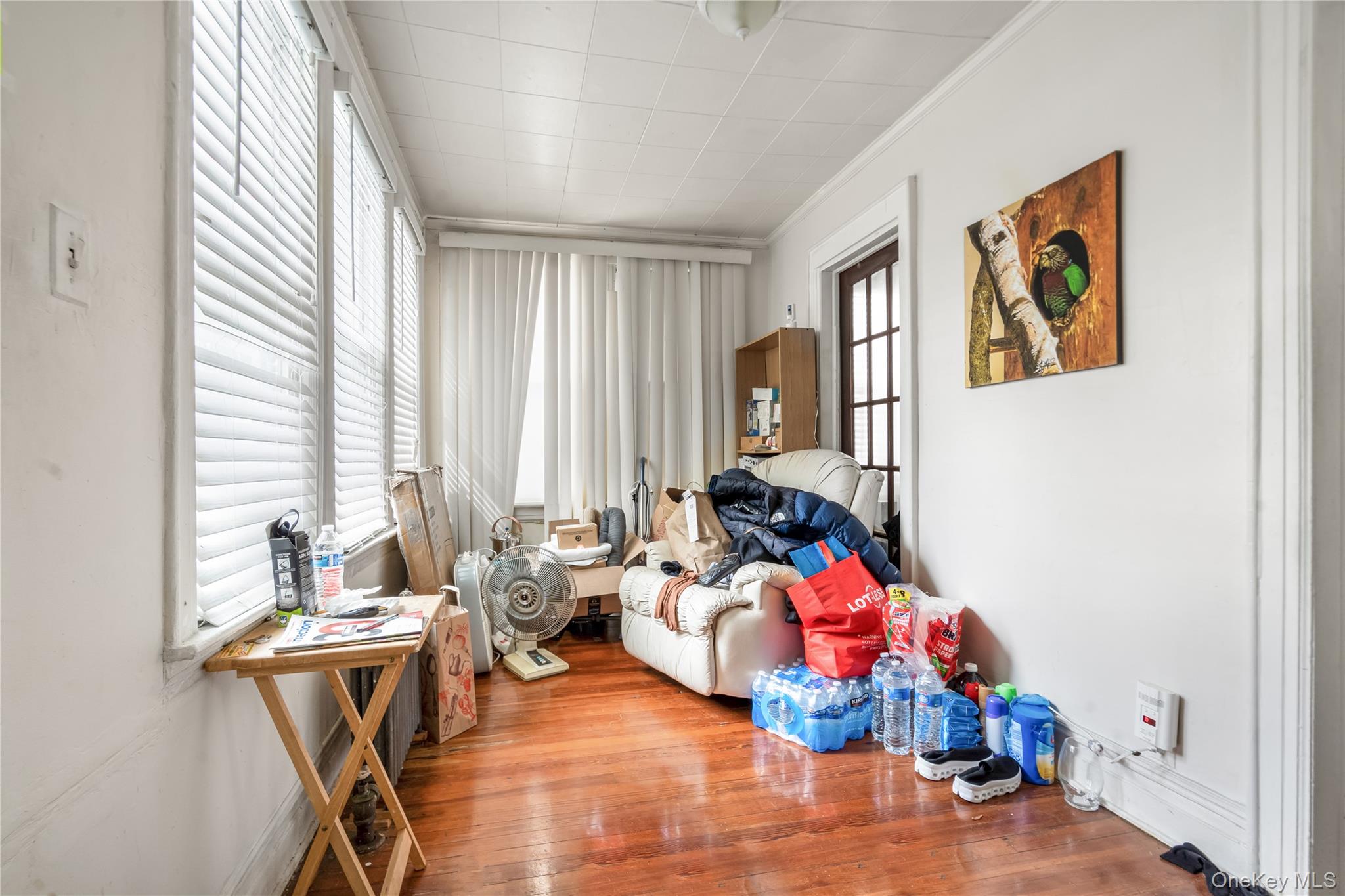 104-37 125th Street Queens, NY 11419 - Photo 9 of 24 a living room with furniture and wooden floor