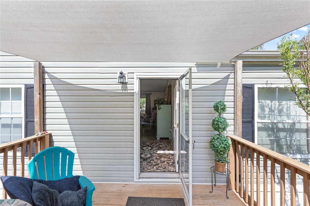 5670 Acadia Street Keystone Heights, FL 32656 - Photo 28 of 65 a view of a porch with furniture