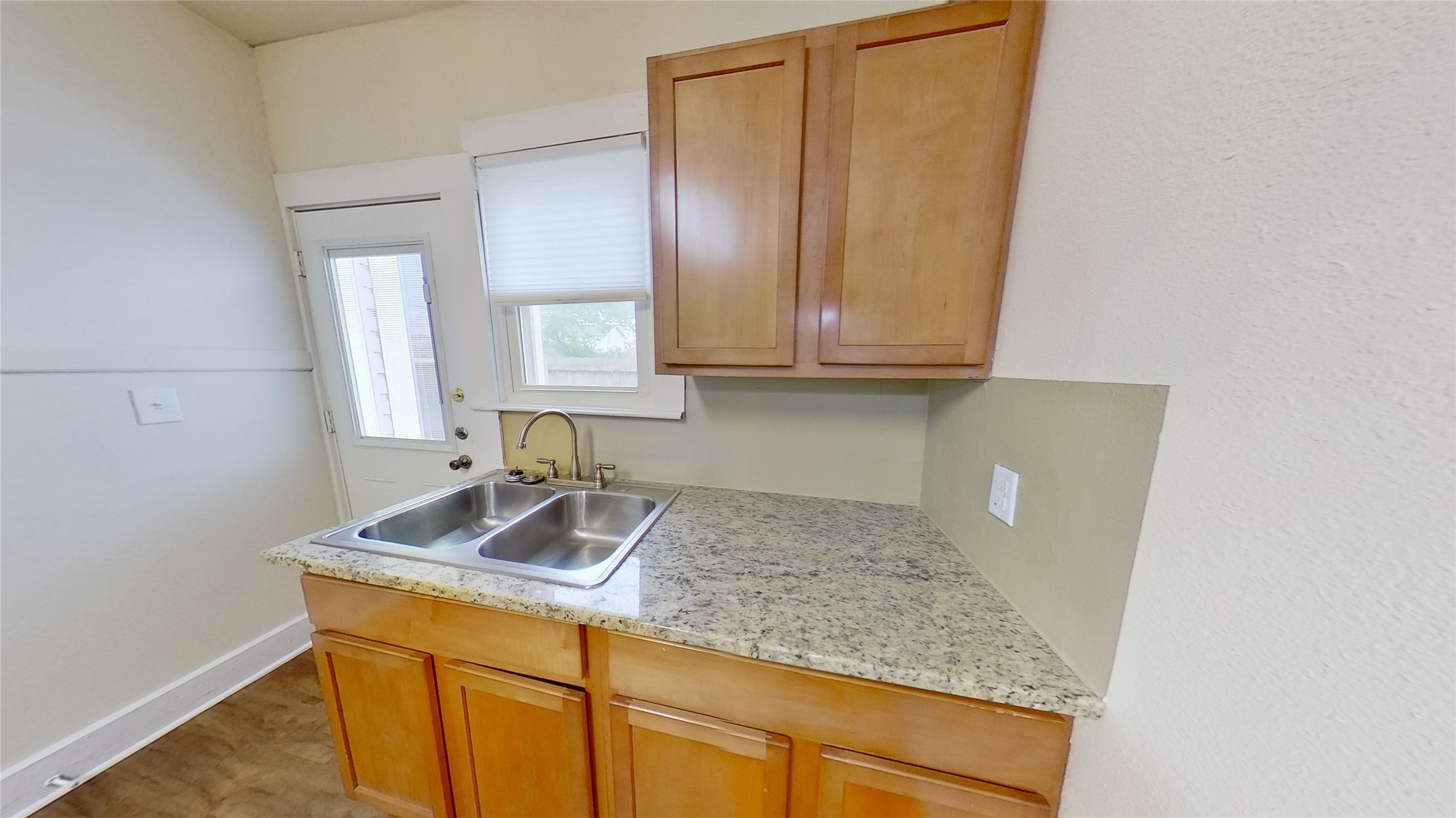 Undisclosed Address Georgetown, TX 78626 - Photo 16 of 25 a kitchen with granite countertop cabinets sink and granite