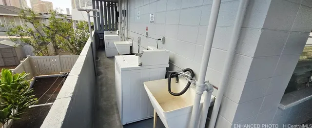 a view of a balcony with furniture and stairs