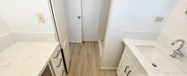 a bathroom with a sink a mirror and shower