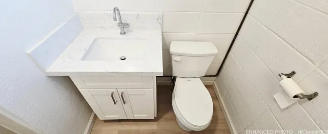 a bathroom with a toilet and a sink