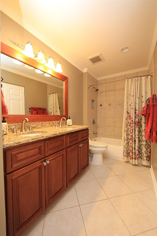 2104 Treverton Place Raleigh, NC 27609 - Photo 18 of 25 That's right this space is completely updated to with tile tub/shower surround, dual-sink vanity. Hall Bathroom