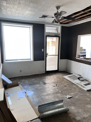 a view of kitchen with sink refrigerator and microwave