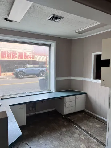 a bath tub sitting in a bathroom next to a window