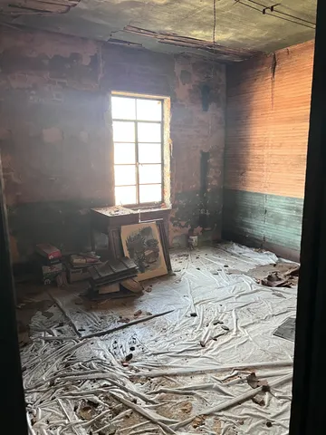 a view of a room with rack and toys