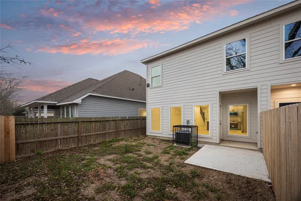 a view of a house with a wooden deck