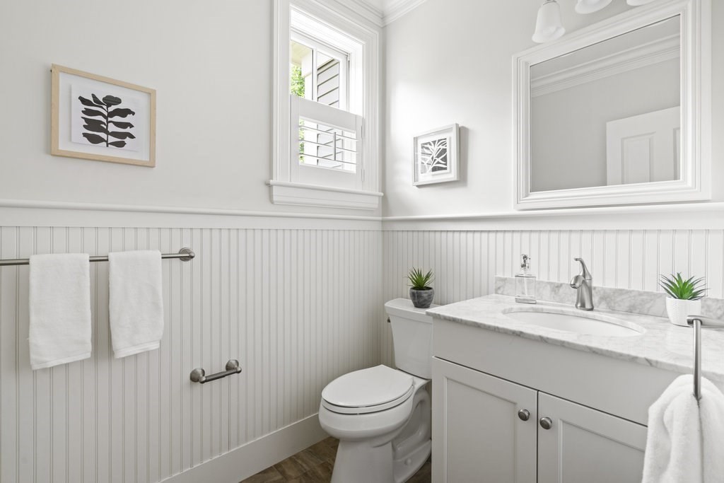 279 Emerson Road Lexington, MA 02420 - Photo 11 of 29 a bathroom with a granite countertop toilet sink and mirror