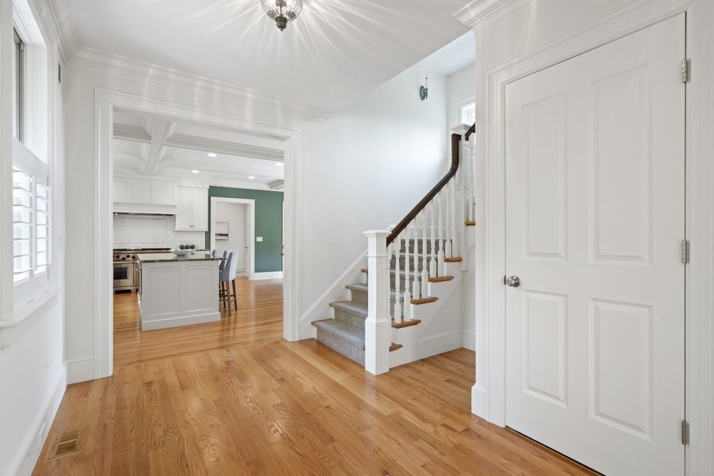 279 Emerson Road Lexington, MA 02420 - Photo 12 of 29 a view of a hallway with wooden floor and staircase