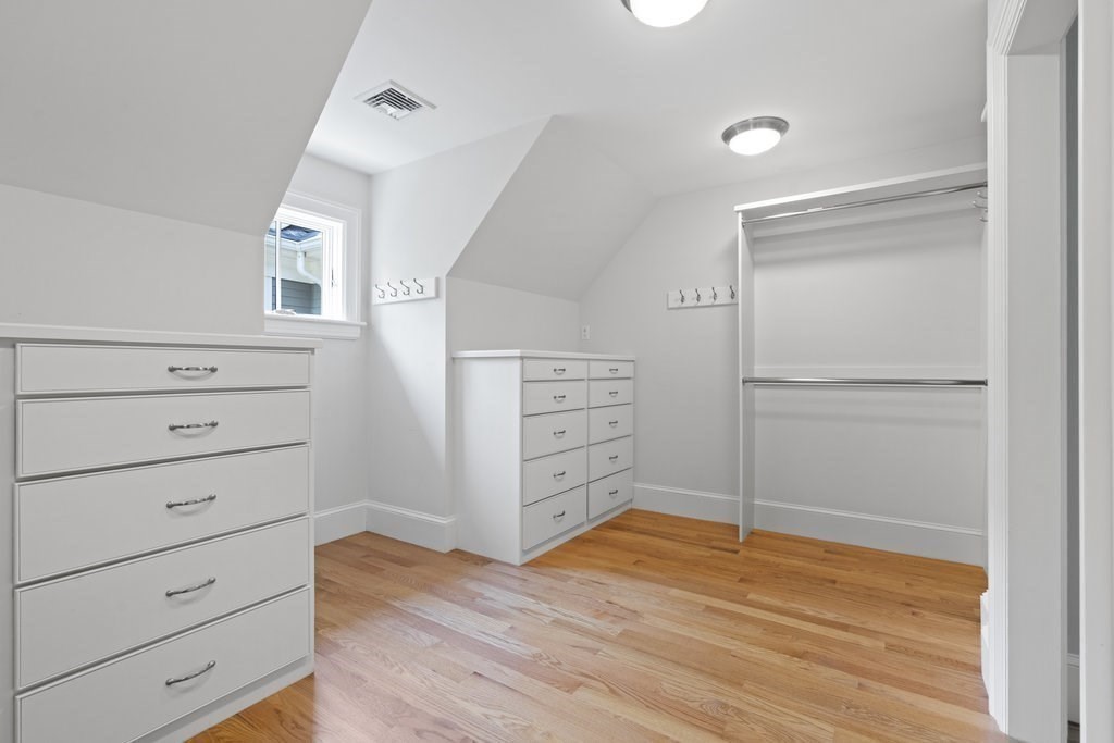 279 Emerson Road Lexington, MA 02420 - Photo 15 of 29 a view of walk in closet with empty racks