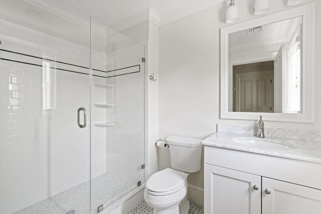 279 Emerson Road Lexington, MA 02420 - Photo 25 of 29 a bathroom with a granite countertop sink toilet and shower